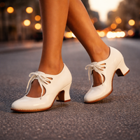 A model wearing the red leather lace heels, styled with a sophisticated outfit for a special occasion.