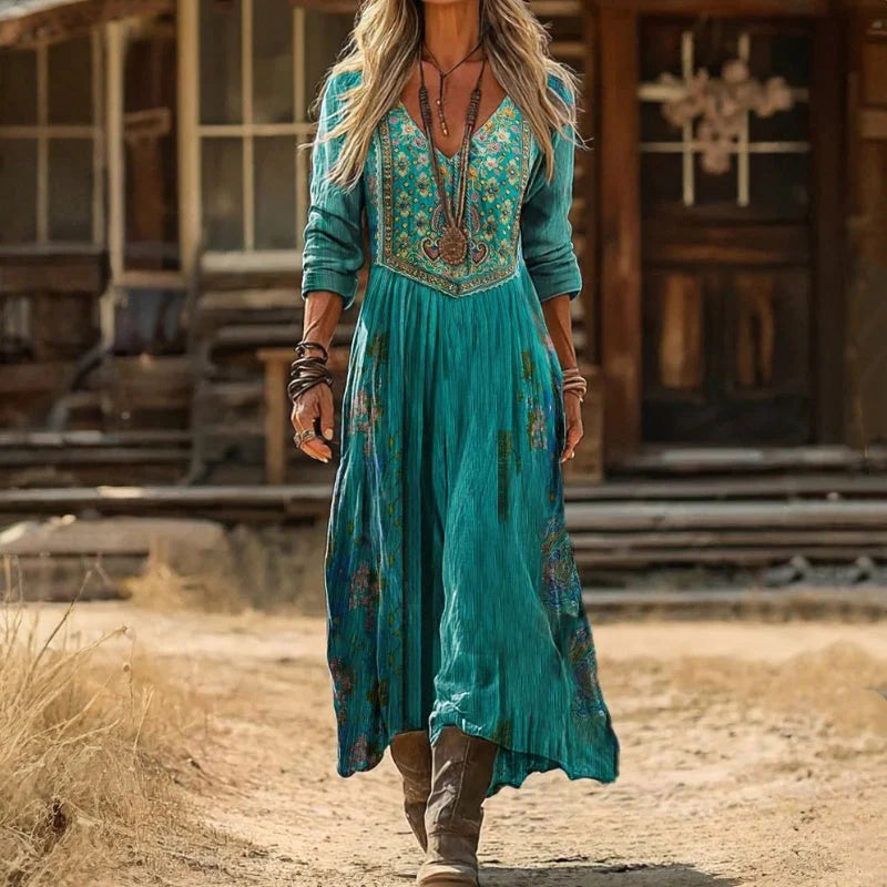 Side profile of the flowing Rhiannon bohemian maxi dress, highlighting the elegant drape.