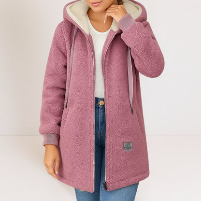 Side profile of a woman showcasing the flattering fit of the women's fleece jacket outdoors.