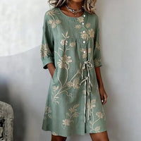 Detailed shot of the lightweight fabric and delicate floral print on the Seraphina summer dress, featuring a side pocket.