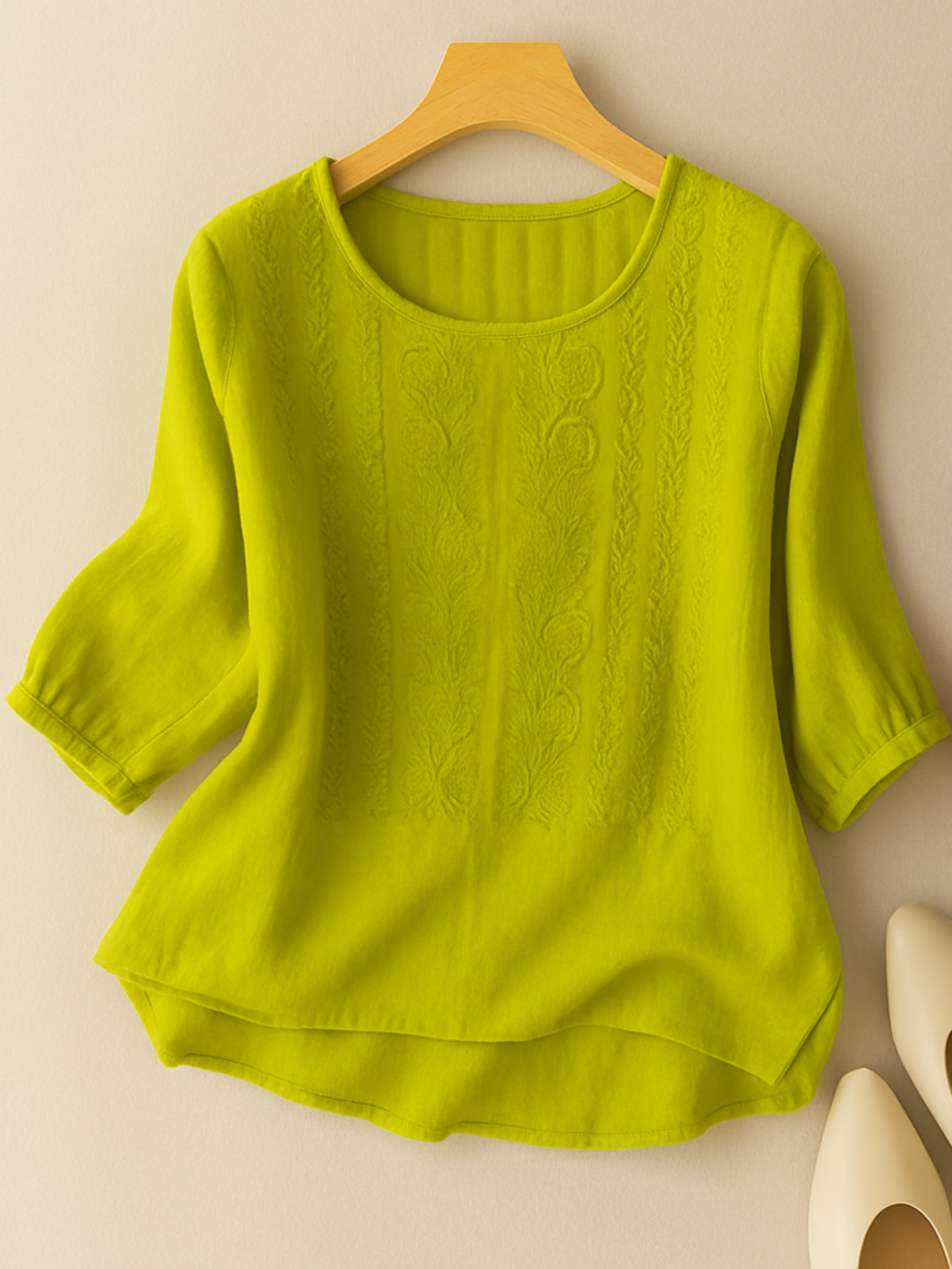 Back view of the yellow green Elodie relaxed embroidered blouse, showing the smooth, unadorned fabric.