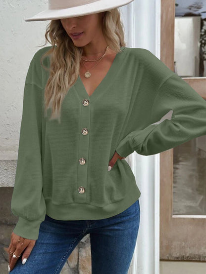 Model wearing the Elowen matcha green waffle-knit V-neck blouse, showcasing a fresh and vibrant style.