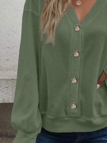 Full length shot of the matcha green waffle-knit blouse, ideal for spring and summer styling.