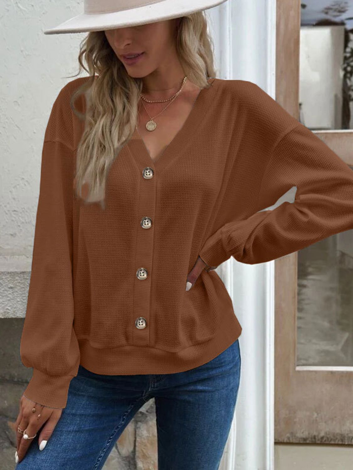 Front view of the Elowen caramel waffle-knit V-neck blouse, offering a warm and inviting tone.