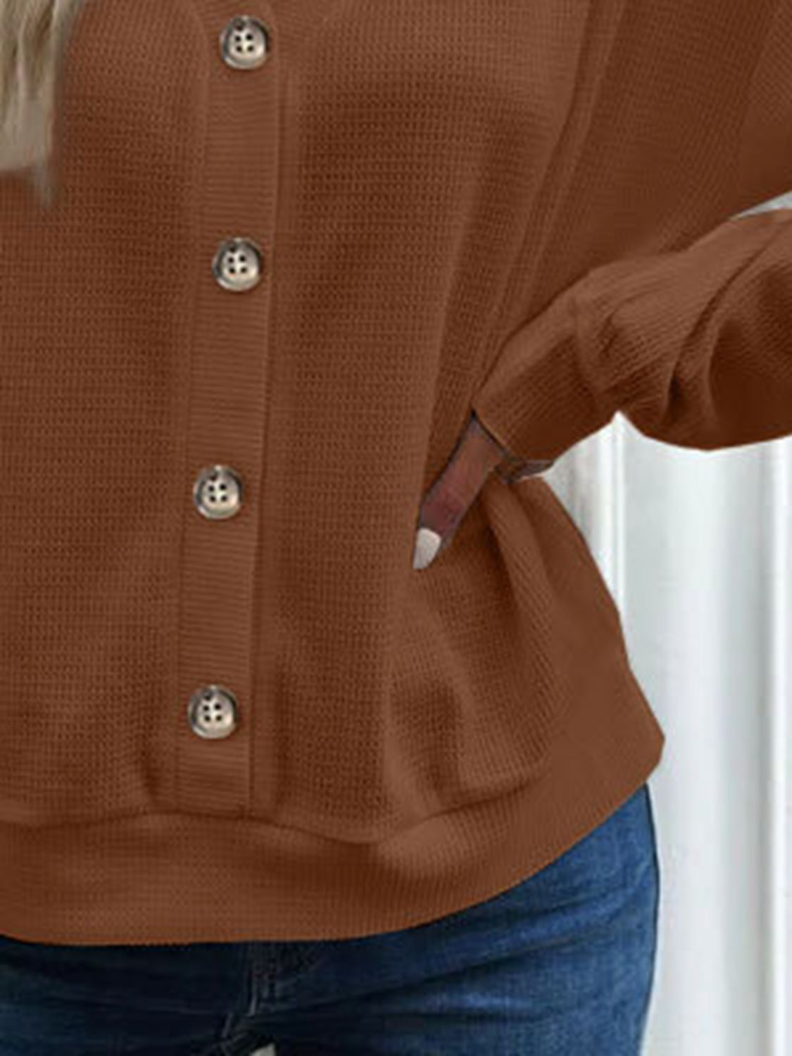 Close-up of the caramel waffle-knit fabric, revealing the rich colour and soft texture of the blouse.