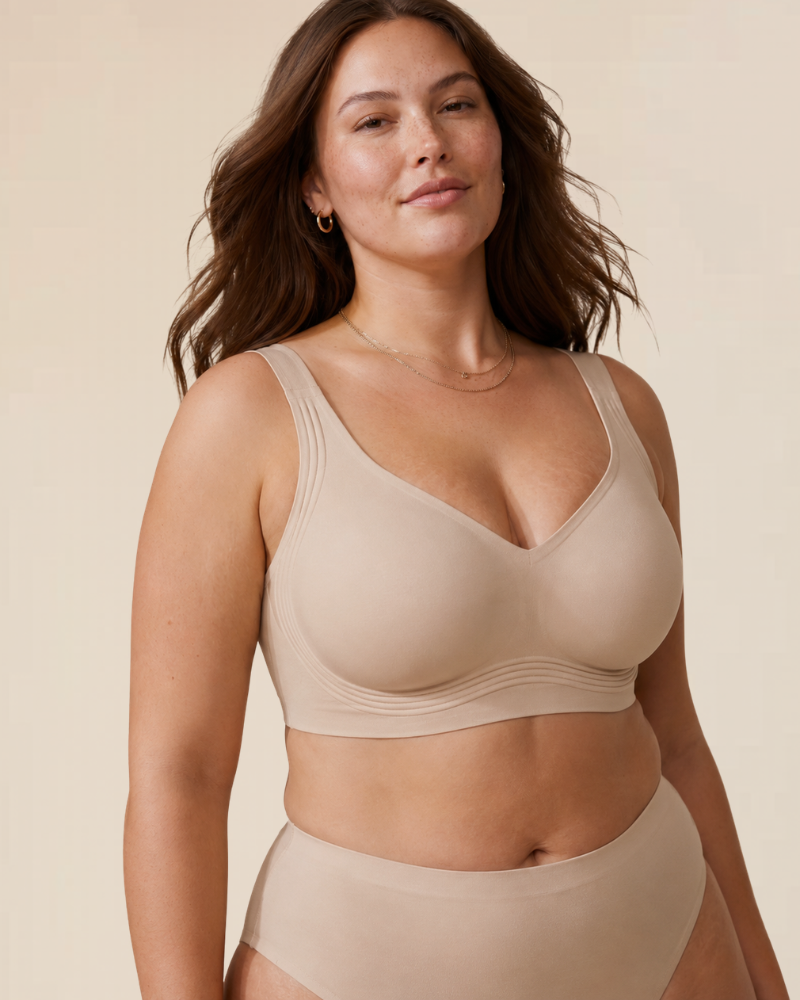 Rear view of the beige comfort wireless bra, showing the secure hook-and-eye closure and adjustable straps.