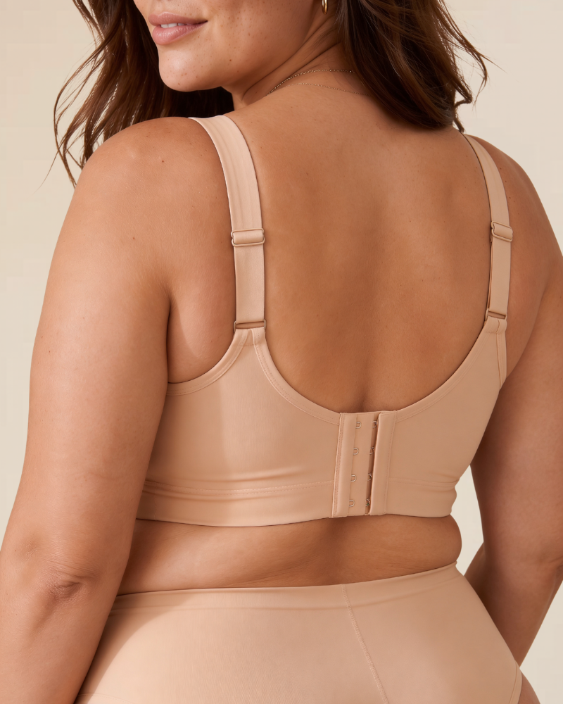 Close-up detail of the soft, breathable fabric texture of the wireless comfort bra in a light colour.