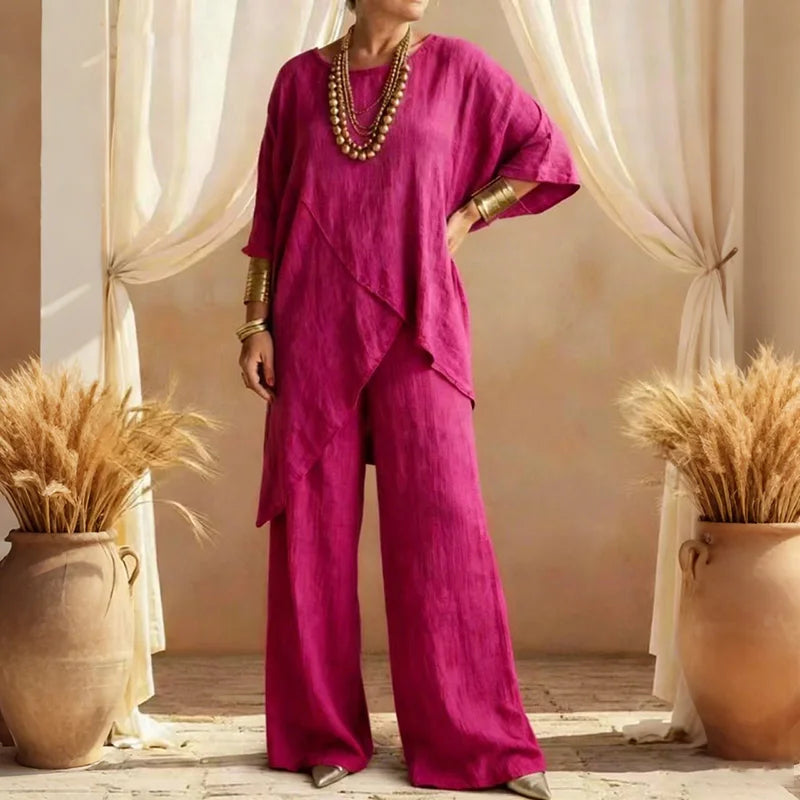 Overhead flat lay of the complete Evie two-piece set in a soft pink, illustrating the coordinated design and material.