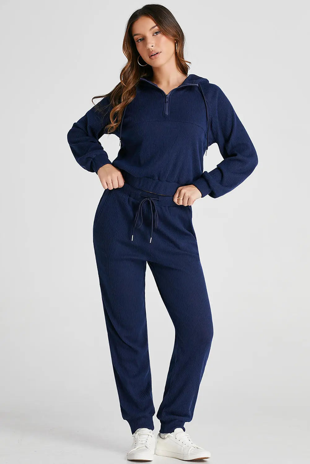Back view of the Hadley active set, displaying the comfortable fit of the navy joggers and the hoodie's silhouette.