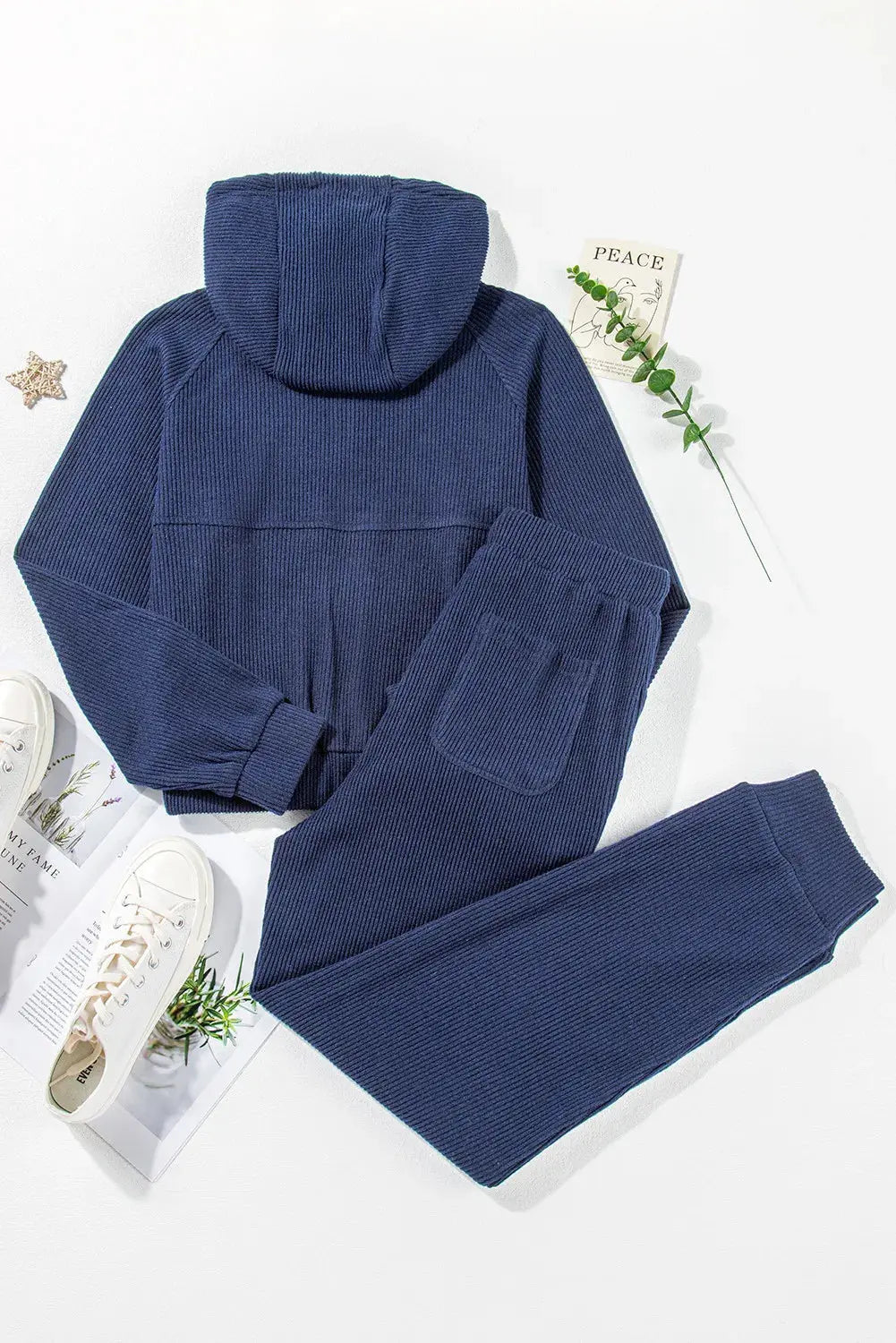 Overhead flat lay of the folded navy Hadley two-piece active set, showing the complete ensemble neatly presented.