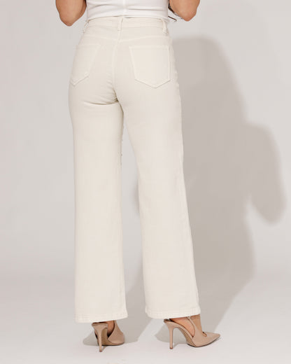 Rear view of the beige wide-leg jeans, focusing on pocket placement and overall fit from behind.