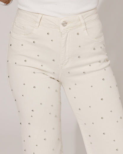 Detail shot of the waistband and button closure of the Inara beige wide-leg jeans, with a subtle brand tag visible.