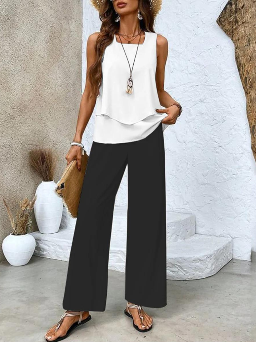Side profile of a model wearing the comfortable Anya two-piece set, highlighting the flow of the printed trousers.