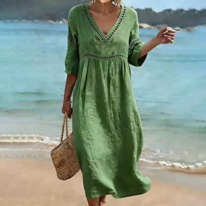 Back view of the pink Inès embroidered dress, showing the relaxed fit and mid-calf hem, perfect for comfortable wear.