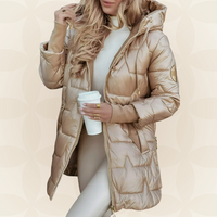 Front view of the beige Inez hooded winter jacket, showcasing its padded texture and zipper.
