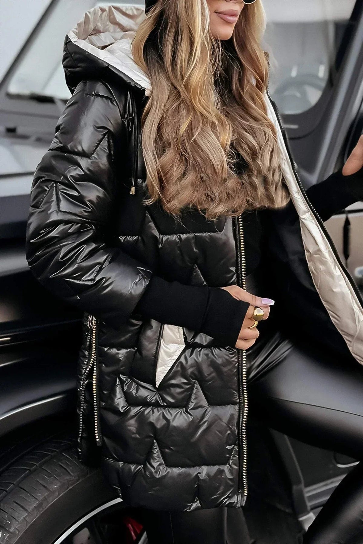 Back view of the brown Inez hooded winter jacket, emphasizing its streamlined silhouette.