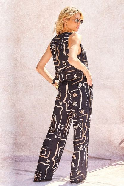 Model seated, showcasing the comfort and relaxed fit of the wide-leg trousers.