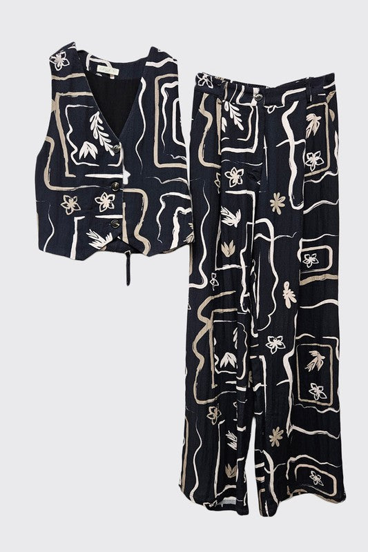 Folded view of the patterned wide-leg trousers, illustrating the quality of the material.