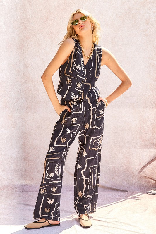 Detail shot of the unique pattern on the fabric of the comfortable wide-leg trousers.