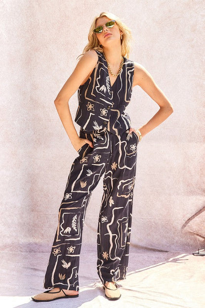 Detail shot of the unique pattern on the fabric of the comfortable wide-leg trousers.