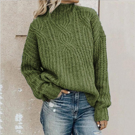 Front view of the Anya elegant knitted jumper in a soft green shade, showcasing its refined texture and drape on a model.