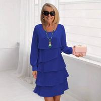 Woman wearing the blue Serena elegant ruffle dress, styled with subtle accessories for a chic, comfortable look.
