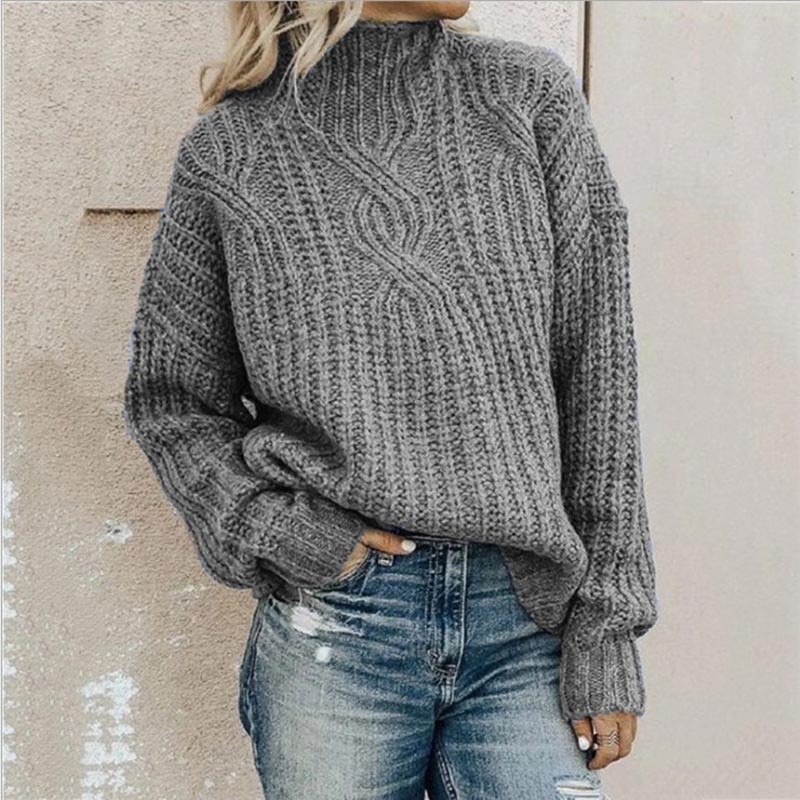 Lifestyle shot of the Anya elegant knitted jumper in pink, styled casually with jeans, perfect for everyday wear.