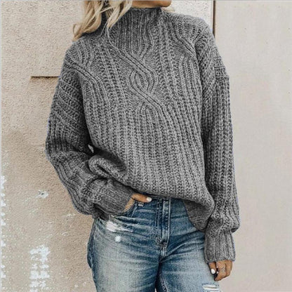 Lifestyle shot of the Anya elegant knitted jumper in pink, styled casually with jeans, perfect for everyday wear.