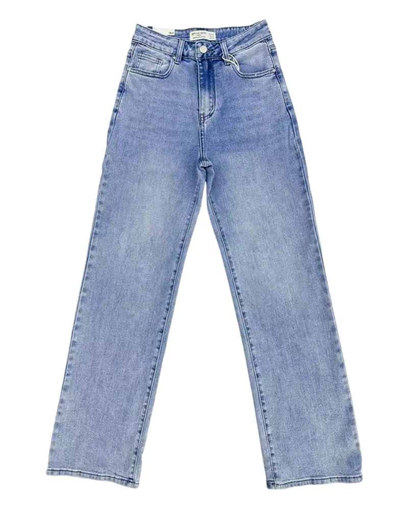 Model from the waist down, showcasing the comfortable drape of the blue Juniper relaxed straight leg jeans with trainers.