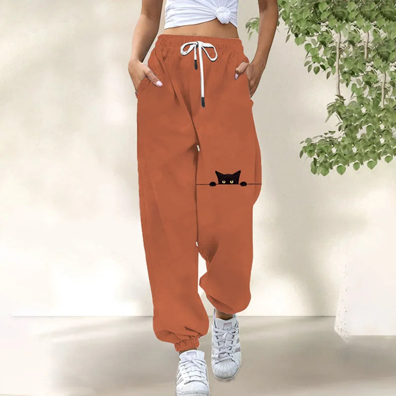 Rear view of the women's stylish cat print trousers, showing the back pocket detail and overall silhouette from behind.