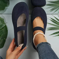 Pair of lightweight Linnea ballet flats packed in a travel bag, ideal for holidays and extended trips.