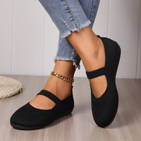 Side profile of elegant women's ballet flats in beige, highlighting the flexible and lightweight design.
