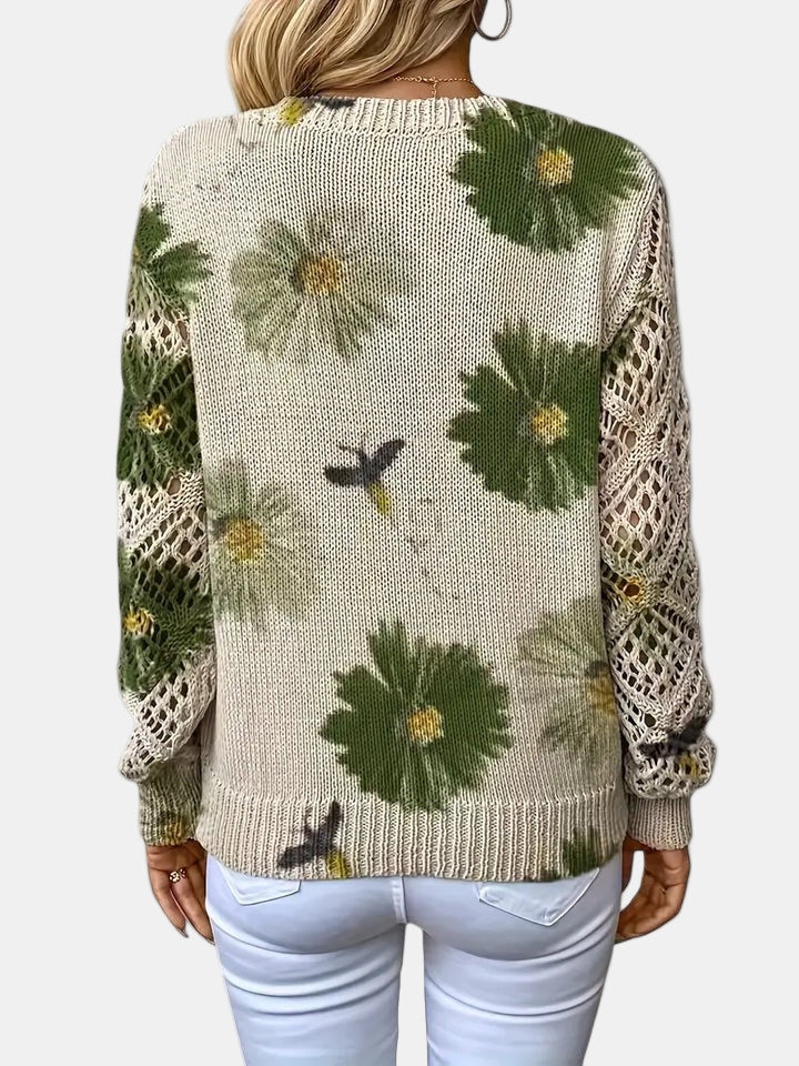 Purple floral knit V-neck sweater in a studio lighting, showcasing its true colour.