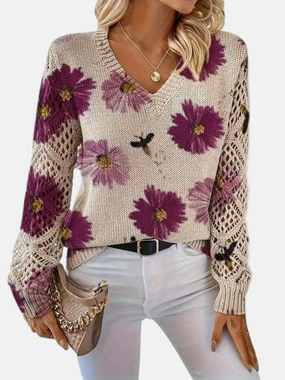 Side profile of a model wearing a red floral knit sweater, demonstrating the comfortable drape.
