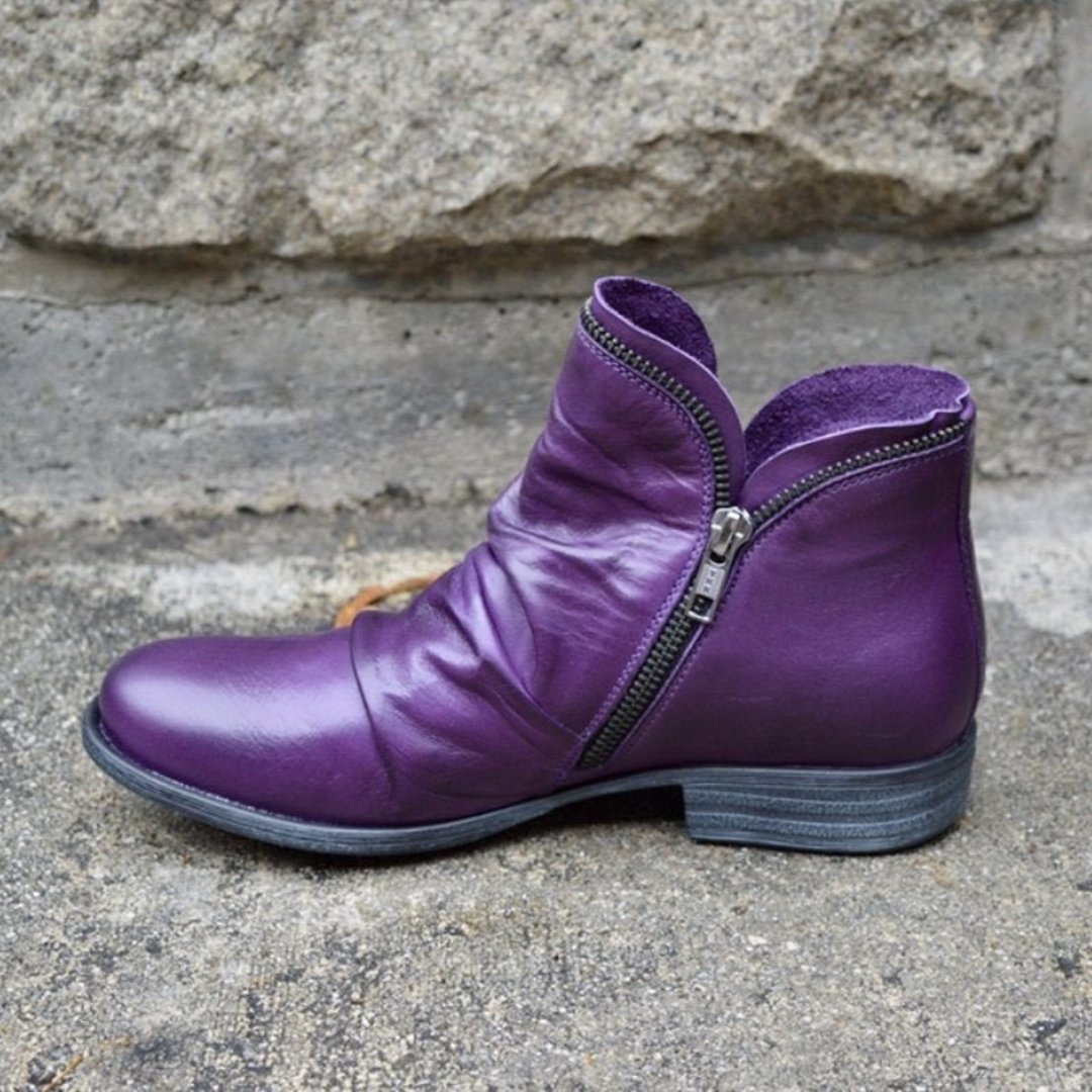 A purple Hadley ankle boot, front view, showcasing its smooth synthetic leather and rounded toe.