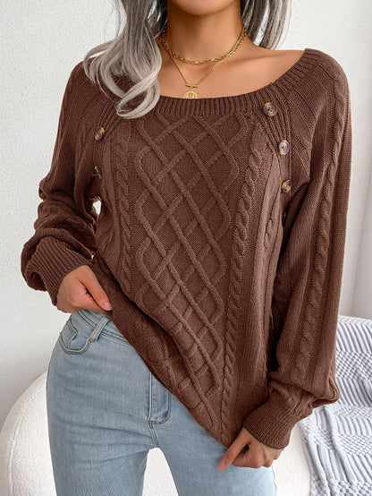 An army green casual knitted sweater draped over a chair, emphasising its breathable material.