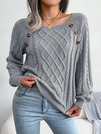 Overhead shot of the white Lotte casual knitted sweater, neatly folded.