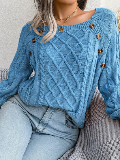 Detail of the ribbed cuffs and hem on the purple Lotte casual knitted sweater.