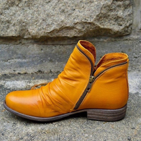 A pair of blue Hadley ankle boots, styled casually, emphasising their versatile design for everyday wear.