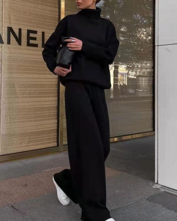 Side profile of a woman casually styled in the Lotte women's loungewear set, demonstrating its elegant drape.