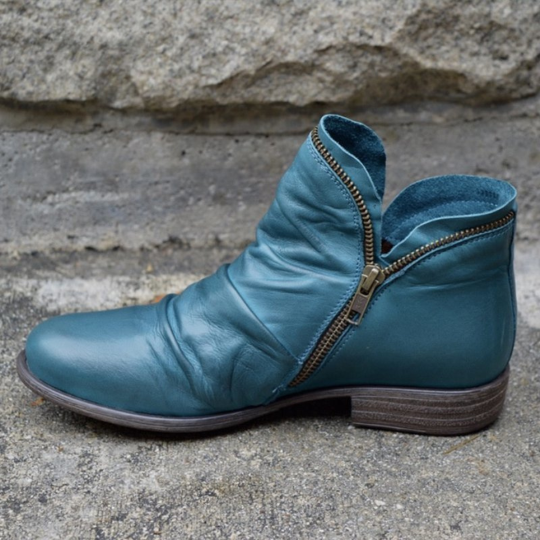Close-up detail of the red Hadley ankle boot's sole, illustrating the anti-slip rubber texture.