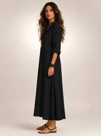 A woman enjoying a sunny day, styled in the comfortable yellow Lotte floral flowing maxi dress.