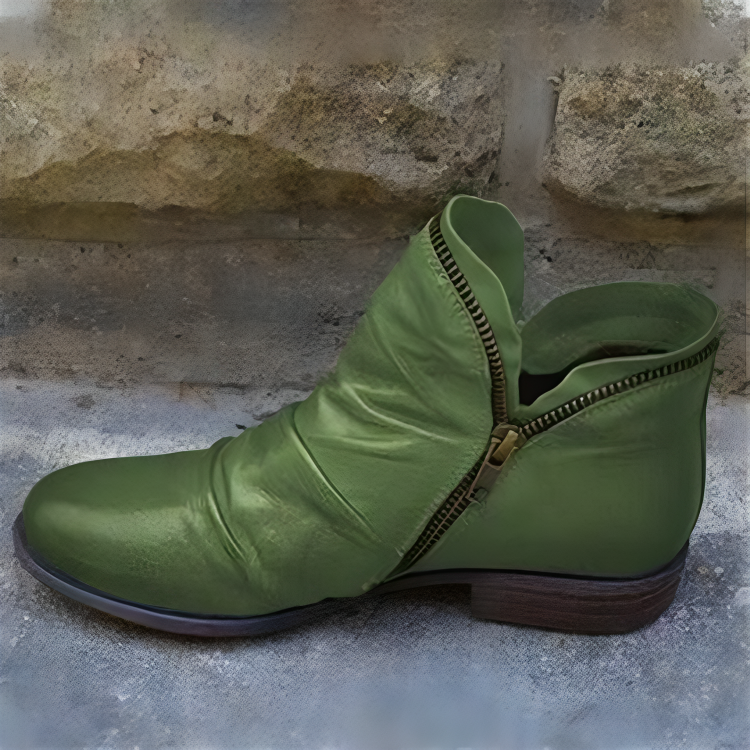 A woman wearing Hadley ankle boots in a natural outdoor setting, demonstrating their comfort and style.