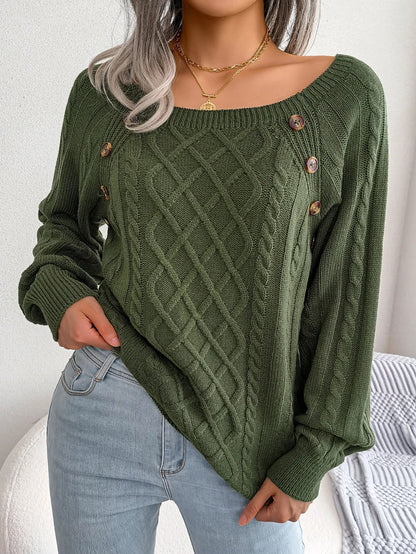Model posing casually in the black Lotte knitted sweater, showing its modern appeal.