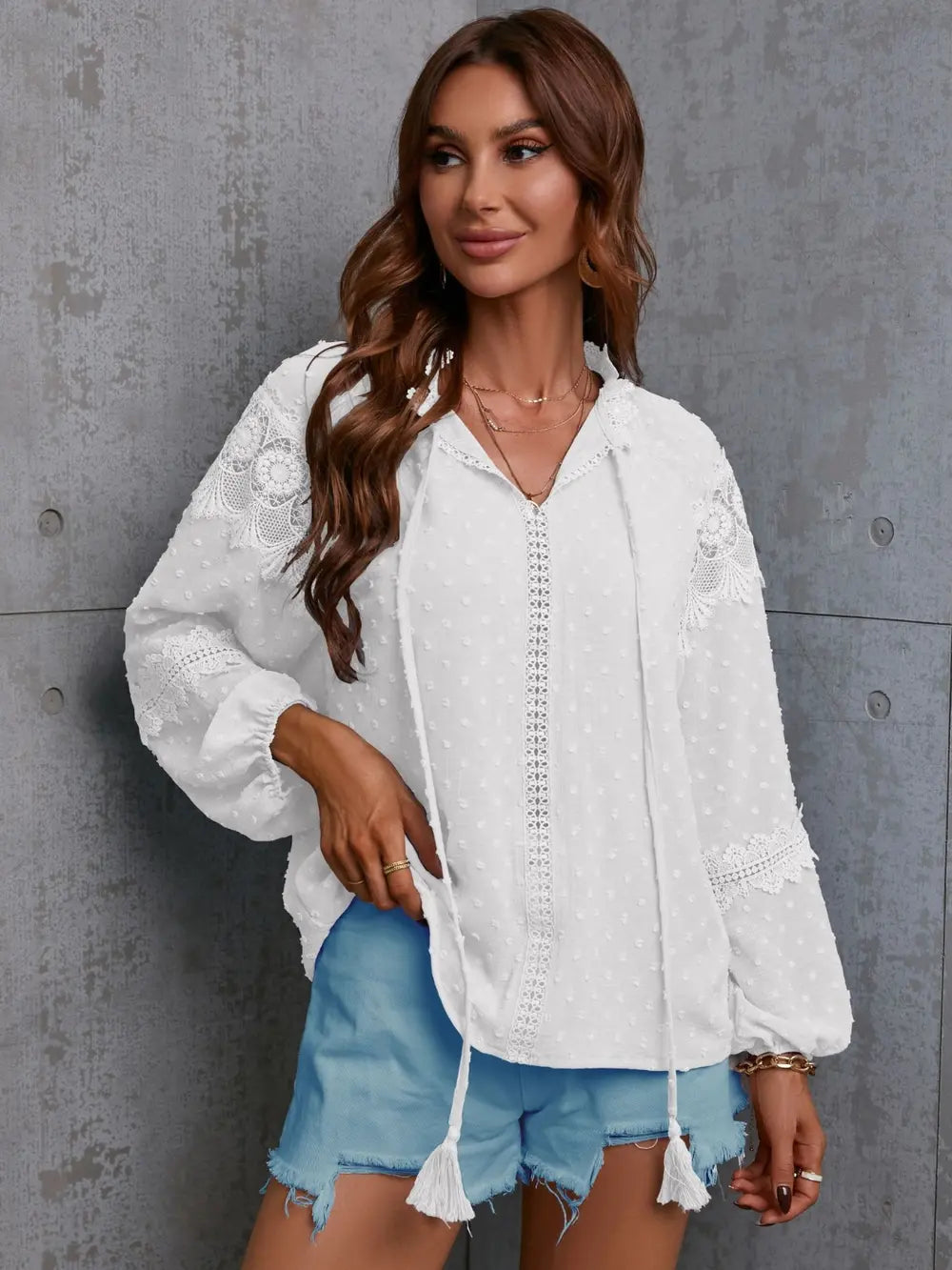Side profile of the moss-colored crochet blouse, highlighting the flowy sleeves and comfortable fit.