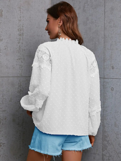 Detail shot of the sleeve cuff on the crochet blouse, emphasizing the quality stitching and material.