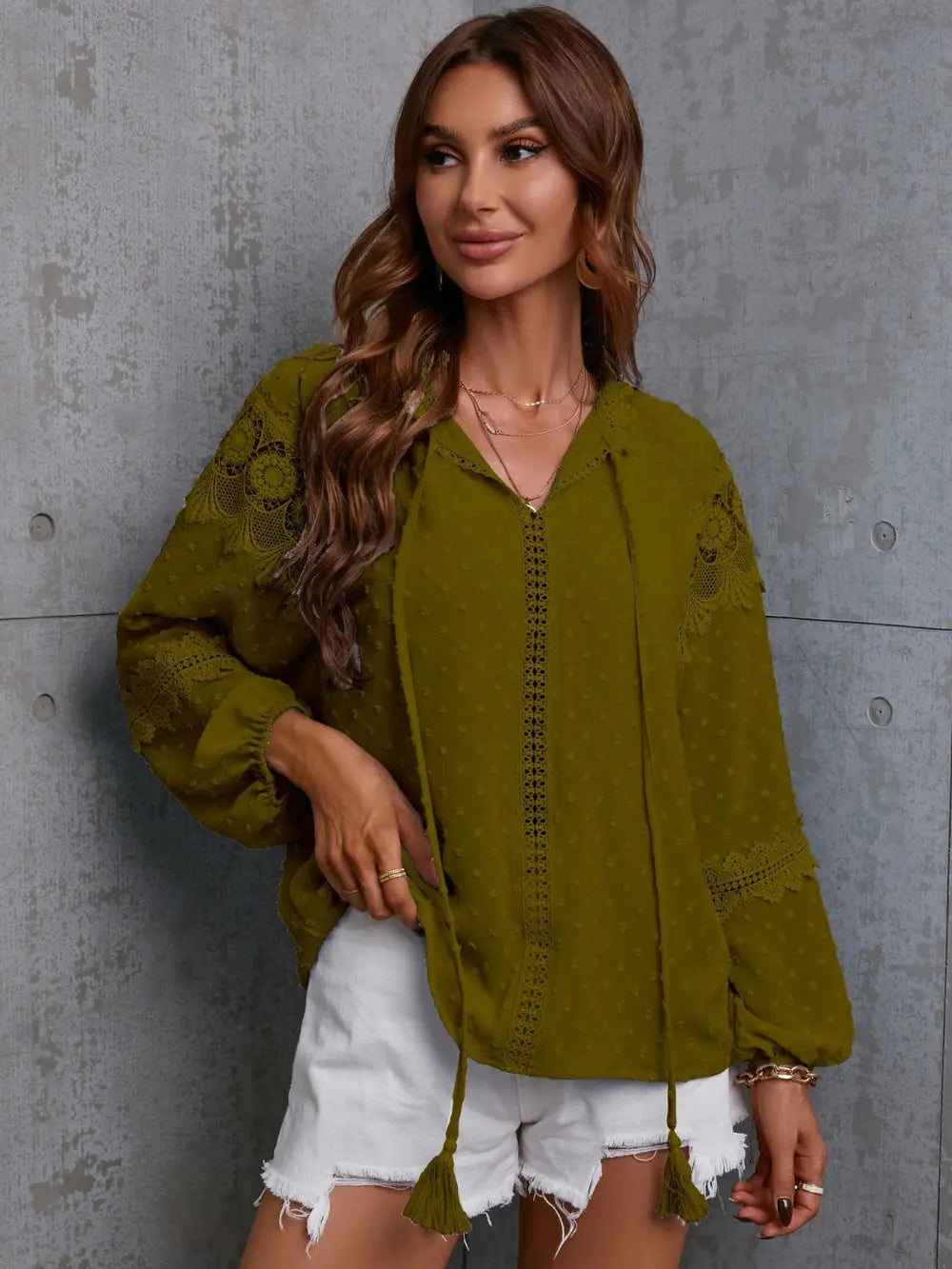 Flat lay of the wine crochet tassel tie neck blouse, displaying its full design and texture against a simple background.