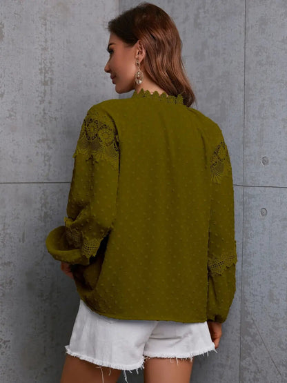 Close-up on the tassel ties of the crochet blouse, featuring their decorative and functional elements.