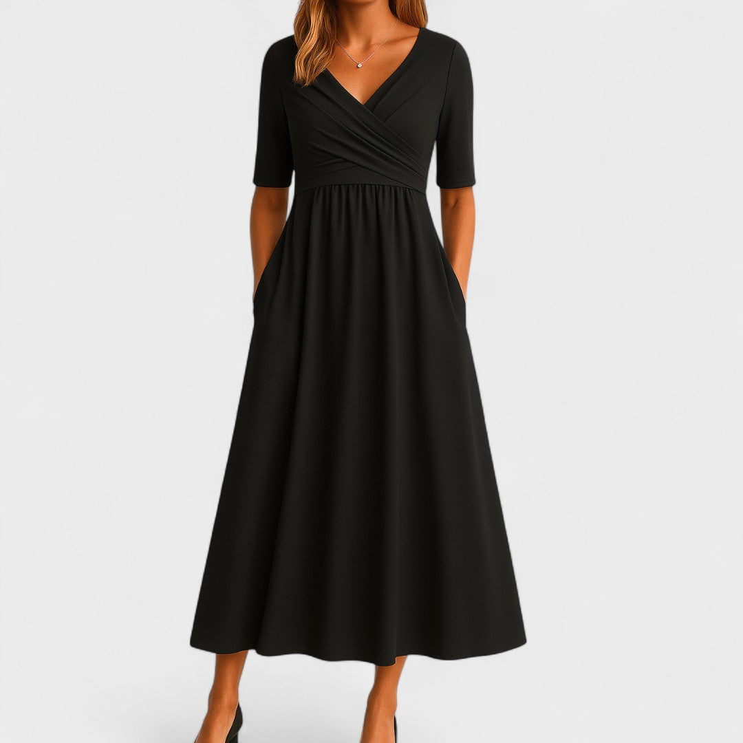 Close-up detail of the gathered pleats on the bodice of the Lynton elegant midi dress, showing fabric texture.