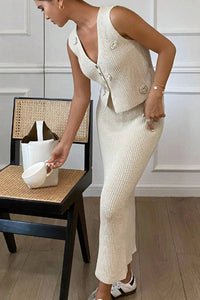 Lifestyle shot of the tan knitted two-piece set, styled for a casual outdoor setting.